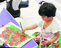 A student of Millennium School participates in a drawing competition during the Spring Carnival in Gurgaon