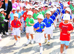 Children of Millenium School participate in a marathon race in Karnal.