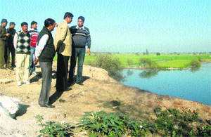 Deputy Commissioner Dr Saket Kumar (second from right) and other officers of the district on a visit to the Chilli Lake. 