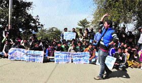 SFI activists raise slogans in protest against the fee hike at Himachal Pradesh University in Shimla.