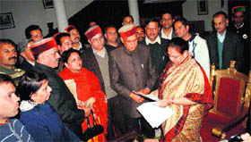 BJP members led by Leader of Opposition PK Dhumal submit a memorandum against decisions of the Congress government at Raj Bhavan in Shimla on Monday.