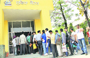 A long queue of applicants apply for documents at Suwidha Centre in Jalandhar on Monday. 