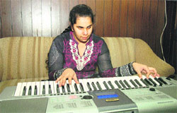 Visually impaired Gurleen Kaur plays the keyboard at her place in Jalandhar
