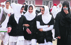 Girls head for their classes after the reopening of schools in Srinagar. Schools and colleges