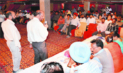 GLADA officials conduct an auction of residential plots in Dugri, Phase I, Ludhiana, on Monday. Photo: Inderjeet Verma
