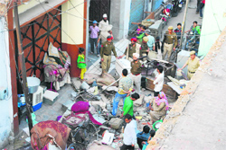 The police inspects the spot after miscreants ransacked Dalits houses in Ludhiana on Monday. Photo: Inderjeet Verma