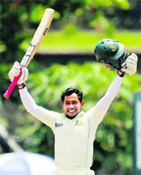 Mushfiqur Rahim celebrates after reaching his double century.