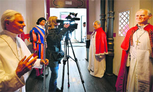 Statues of Pope John Paul II (R) and Pope Benedict XVI (L) on display at the Rome wax museum on Monday.