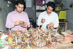 Electricians busy winding electric motors of ceiling fans to meet the demand for their products in the ensuing summer, in Bathinda on Tuesday.