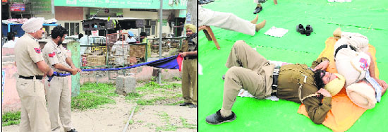 Policemen lend a hand to their colleague in the process of tying turban; policemen catch forty winks after maintaining vigil on the roads and looking for farmers, who planned to stage a dharna in Bathinda, on Tuesday.
