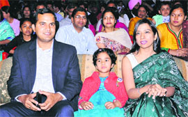 Deputy Commissioner KK Yadav (below) watches the function.