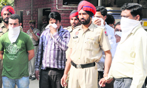 The police produces the accused at the district courts in Mohali on Tuesday.