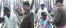 Sub-Inspector Brijpal slaps a man and a girl who tried to cross the Yamuna river using a railway bridge on Tuesday.