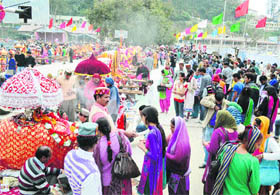 Devotees offer prayers during the Mahashivratri fair in Mandi on Tuesday.