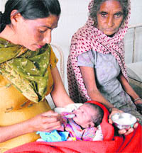 The abandoned baby girl being fed milk at the Jalandhar Civil Hospital on Tuesday.