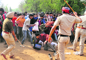 Policemen lathicharge youths during an Army recruitment rally in Ludhiana on Monday.