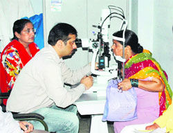 A doctor examins a patient on World Glaucoma Day at Civil Hospital in Amritsar on Wednesday.