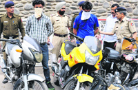 Chain snatchers in police custody at the Sector 17 police station in Chandigarh on Wednesday.