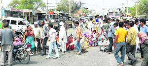 Villagers block traffic after a woman and her newborn baby died at Ratia on Wednesday. 