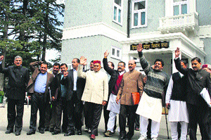 PK Dhumal, Leader of the Opposition, with other BJP MLAs walk out of the Vidhan Sabha on the 2nd day of the Budget session in Shimla on Wednesday. 