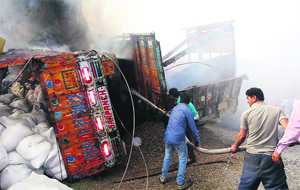 Fire tenders from Pathankot douse fire at Damtal in Nurpur on Wednesday. 