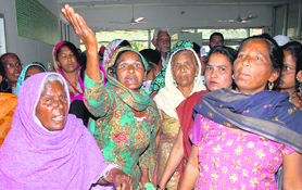 Residents of Kalyanpur village protest againts the SHO of Lambra police station in front of the SSP (Rural) office in Jalandhar on Wednesday.