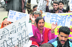 Members of the Estwhile Doda Migrants Committee protest in Jammu on Wednesday. tribune photo: Inderjeet singh 