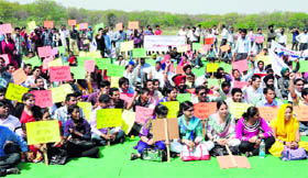 Students from various distance education regional and learning centres protest at the Rally Ground in Sector 25, Chandigarh on Wednesday.
