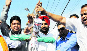 Activists of Bharatiya Janata Yuva Morcha (BJYM) burn an effigy in Amritsar on Thursday in protest against the killing of five CRPF soldiers in Kashmir.