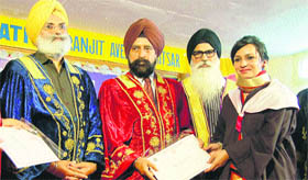 Dr Ajaib Sing Brar (second from left), vice-chancellor, GNDU, awards degree at the convocation of Khalsa College of Education in Amritsar on Thursday.