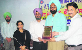 Assistant Director, Youth Services, Punjab, Dr Kamaljit Singh Sidhu (second from right) being presented a memento by the officials of the PTUGZS campus.