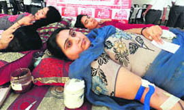 Volunteers donate blood at a camp organised by the Aryans Colleges of Education in Chandigarh on Thursday.