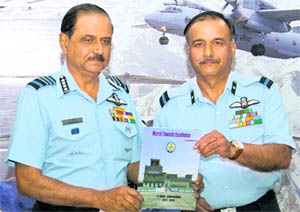 Air Chief Marshal NAK Browne releases the airbase magazine in Chandigarh on Thursday.