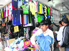 The Municipal Corporation staff clear encroachments at Sadar Bazar in Sector 19, Chandigarh, on Thursday. 