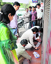 Health Department officials seal a medical store as they raided medical shops in Karnal on Thursday
