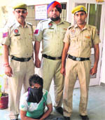 The accused in police custody on Thursday. 
