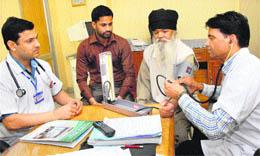 Doctors check patients at a hospital during a free kidney check-up in Jalandhar on Thursday.