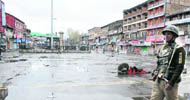 A paramilitary soldier patrols the Lal Chowk area, the main business hub of Srinagar