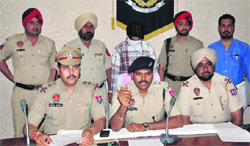 The police gives details about the arrests in the robbery case in Ludhiana on Thursday. Photo: Inderjeet Verma