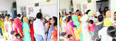 Applicants queue up outside a room in the MCB office where the process of registration for Aadhaar cards is going on; the room inside the Municipal Corporation office, where the process of Aadhaar card registration is going on, is a small one.