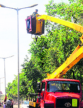 A worker repairs streetlights at Sector 26 on Friday
