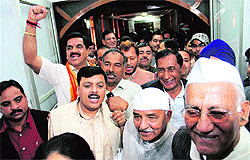 BJP MLAs raise slogans after boycotting the proceedings of the state Assembly in Dehradun on Friday