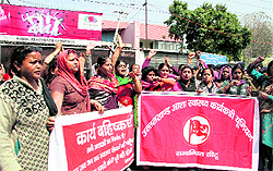 ASHA workers protest in support of their demands near the state Assembly in Dehradun on Friday