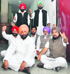 Suspended Congress MLAs protest in front of the Speakers office in Chandigarh on Friday.