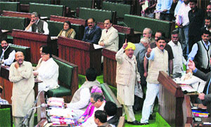 BJP legislators stage a walkout during the Budget session in Jammu on Friday.