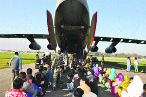 Leh-bound civilians board an IAF aircraft in Jammu on Friday. 