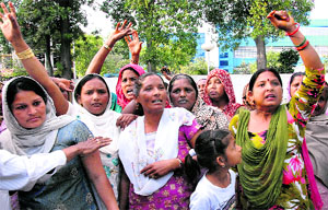 villagers hold a demonstration at Circuit House in Jalandhar on Frdiay