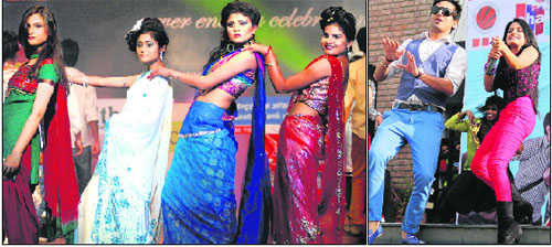 Students of the NIT participate in a fashion show during cultural fest Utkansh-13; and (right) Miss Pooja and other star cast of the forthcoming film Pooja Kiven Aa perform at Lovely Professional University in Jalandhar on Friday. 