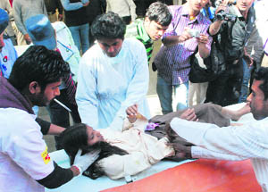 Paramedics take an injured student to a hospital in Ludhiana on Friday.