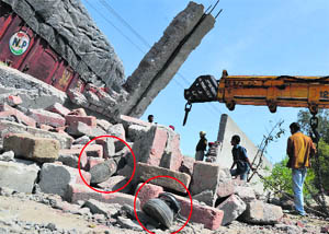 A students shoes lie in the debris at the mishap site at Jandiali village in Ludhiana on Friday. 
